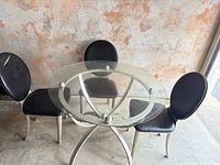 Table and three chairs full view