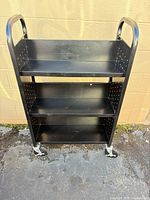 Front view of entire Sandusky 4-shelf utility cart showing shelves, handles and casters