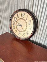 Front view showing full clock face and frame