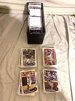 Stacked trading cards and storage box overview