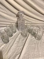 Full set showing decanter, stopper, and seven tumblers