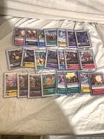 Full layout of 22 sleeved and toploaded Digimon cards