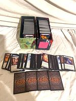 Two full card storage boxes and spread of Flesh and Blood cards