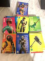 Stacks of Fortnite Panini trading cards displaying various character fronts
