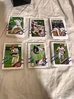 Stacks of Topps baseball cards laid out showing front designs and player variety