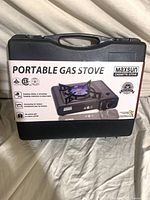 Front view of carrying case with product sleeve showing Maxsun portable gas stove