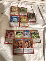 Group of sealed MetaZoo promo card packs laid out on cloth