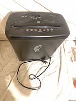 Front angled view showing full shredder body and attached power cord