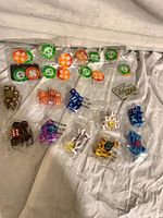 overview of sealed dice packs and tokens laid on cloth