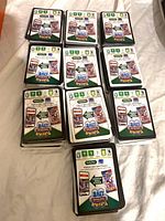 Front view of multiple stacks of Pokémon TCG Live code cards