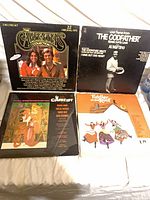 All four album jackets laid out together