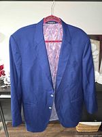 Full front view of royal blue blazer on hanger