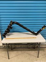 Full view of Saris hitch bike rack on table showing overall structure and four cradle sets