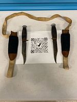 Two knives in sheaths on canvas belt