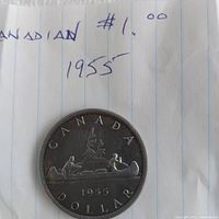 Reverse side showing CANADA, DOLLAR, canoe design, date 1955