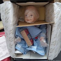 Amanda doll in blue outfit inside original box