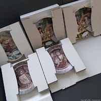 Five boxed decorative plates in packaging