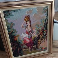 Full view of framed needlepoint artwork