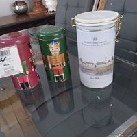 Three Hudson's Bay collectible tins displayed together