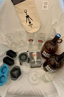 Overview of lot showing growler, glasses, ice molds, wine tote