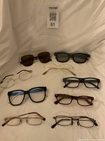 Group shot showing all eyewear pairs arranged on backdrop