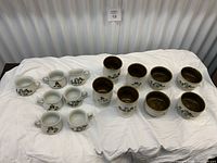 Group shot of all cups and bowls on cloth