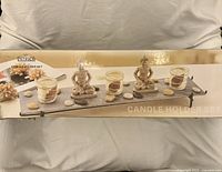 Front of box showing full candle holder set