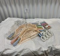 Group shot of hangers and packaged sheet grippers