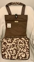 Full front view of folded trolley showing patterned bag and handles