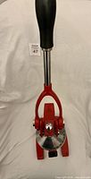 Top view of closed red Palm citrus press