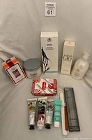 Group shot of all personal care items including lotions, shampoo, scrub, fragrance set, nail care items