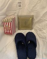Group view showing slippers, popcorn socks carton, La Senza sachet