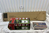 All three boxed items laid out: Rubbermaid mop kit, Hudson sprayer box, Bona refills pack
