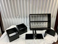 all six black shelves displayed