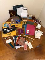 Overall view of assorted stationery on round table