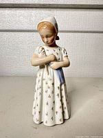 Front view of porcelain girl figurine