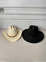 Both hats side by side showing overall condition