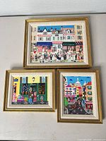 All three framed paintings together