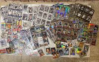 Wide view of entire spread of baseball cards showing quantity and variety