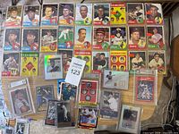 overview of vintage 1963 Topps cards and graded modern cards spread on table