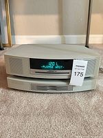 Front view of Bose Wave Music System on CD changer, display lit