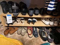 Shelved women’s shoes upper and lower shelves