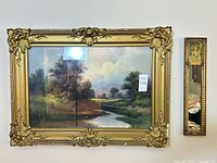 Wide view of both framed pieces on wall