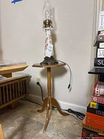 Full view of lamp on pedestal side table