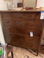 Front view of dresser showing six drawers and overall condition