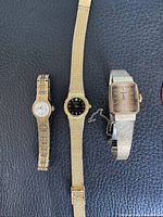 Three vintage women’s wristwatches laid out side by side