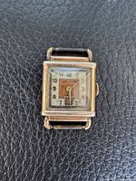 Front view of Clifford watch showing dial, case and missing strap