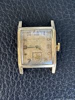 Front view of Elgin wristwatch showing dial, hands and crystal