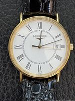 Front view of watch showing dial, case, strap texture