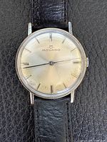 Front view of Movado watch showing dial, hands, indices, and case condition